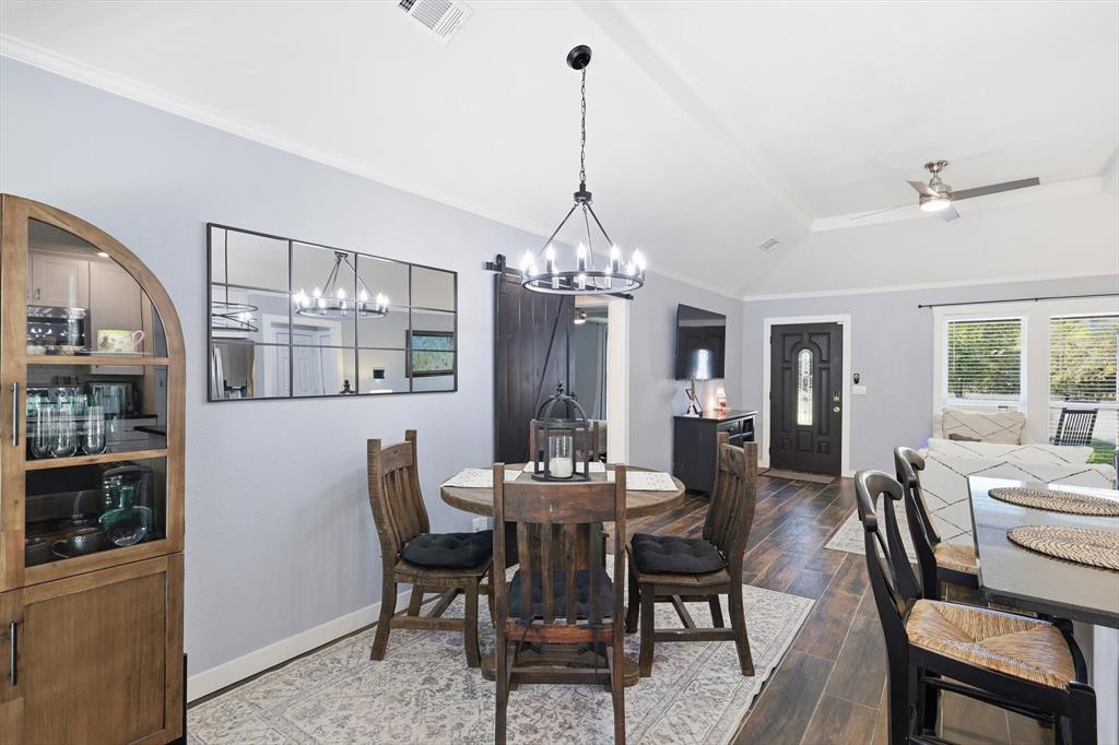 138 Gobbler Road Nocona, TX 76255 - Photo 10 of 36 a dining room with furniture a chandelier and window