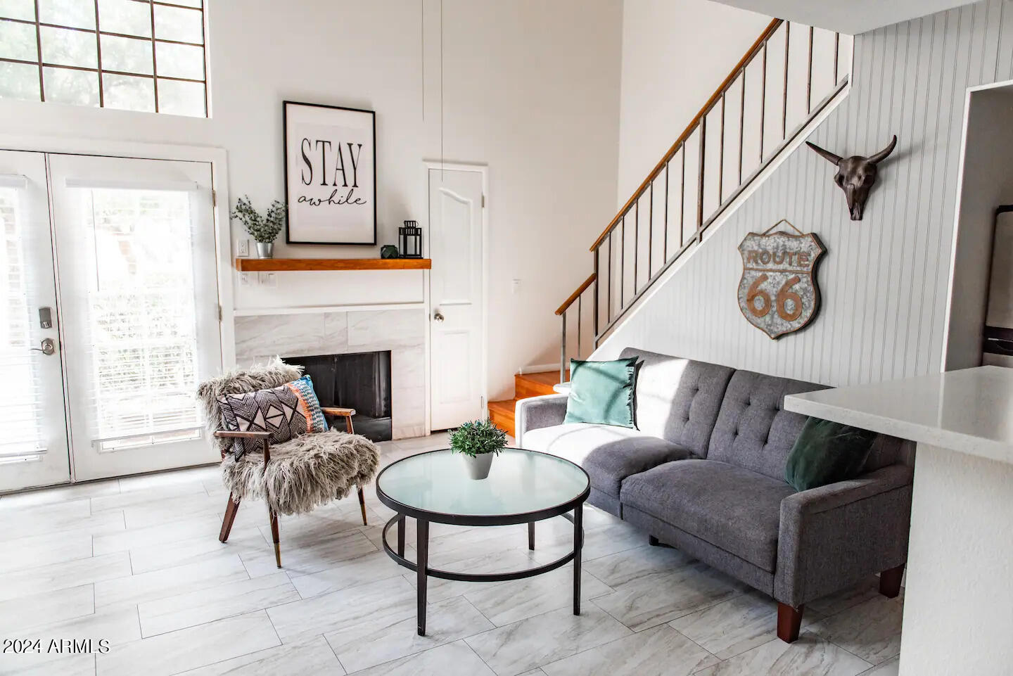 a living room with furniture and a fireplace