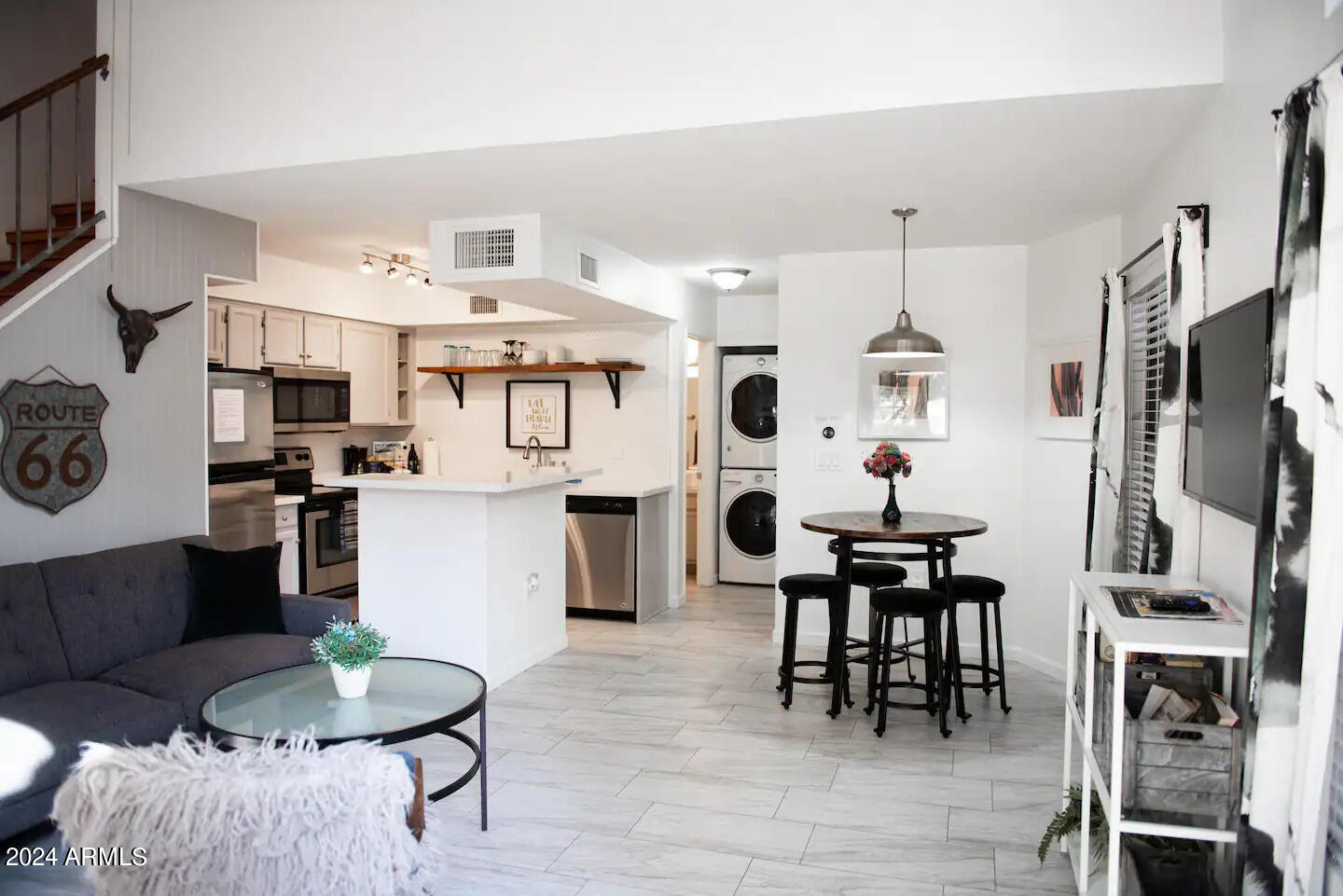 602 North May, Unit 7 Mesa, AZ 85201 - Photo 4 of 18 a living room with furniture a dining table and kitchen view