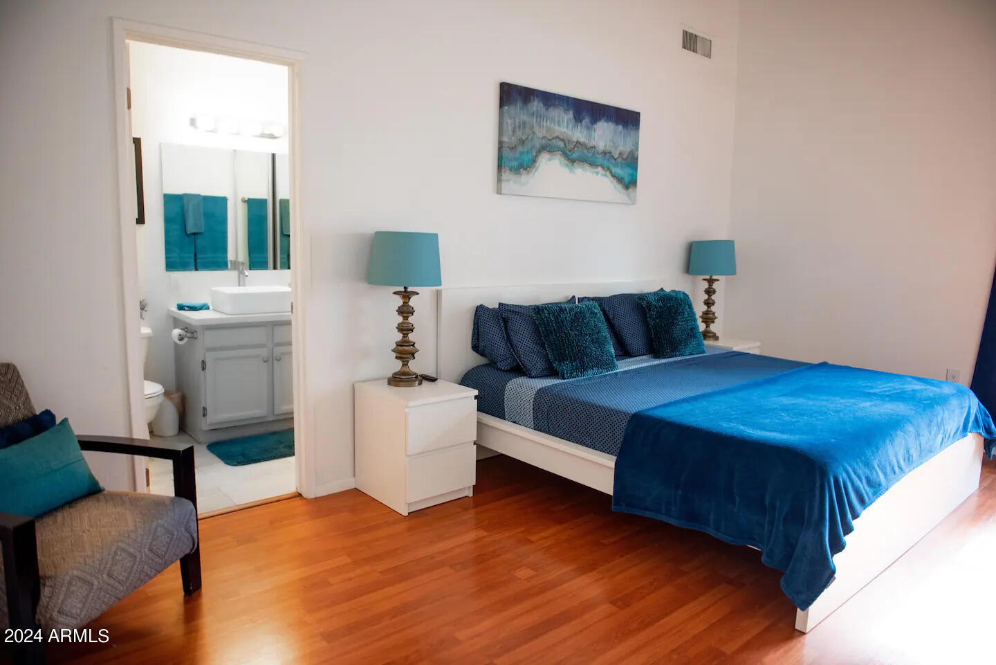 602 North May, Unit 7 Mesa, AZ 85201 - Photo 7 of 18 a bedroom with a bed and a couch