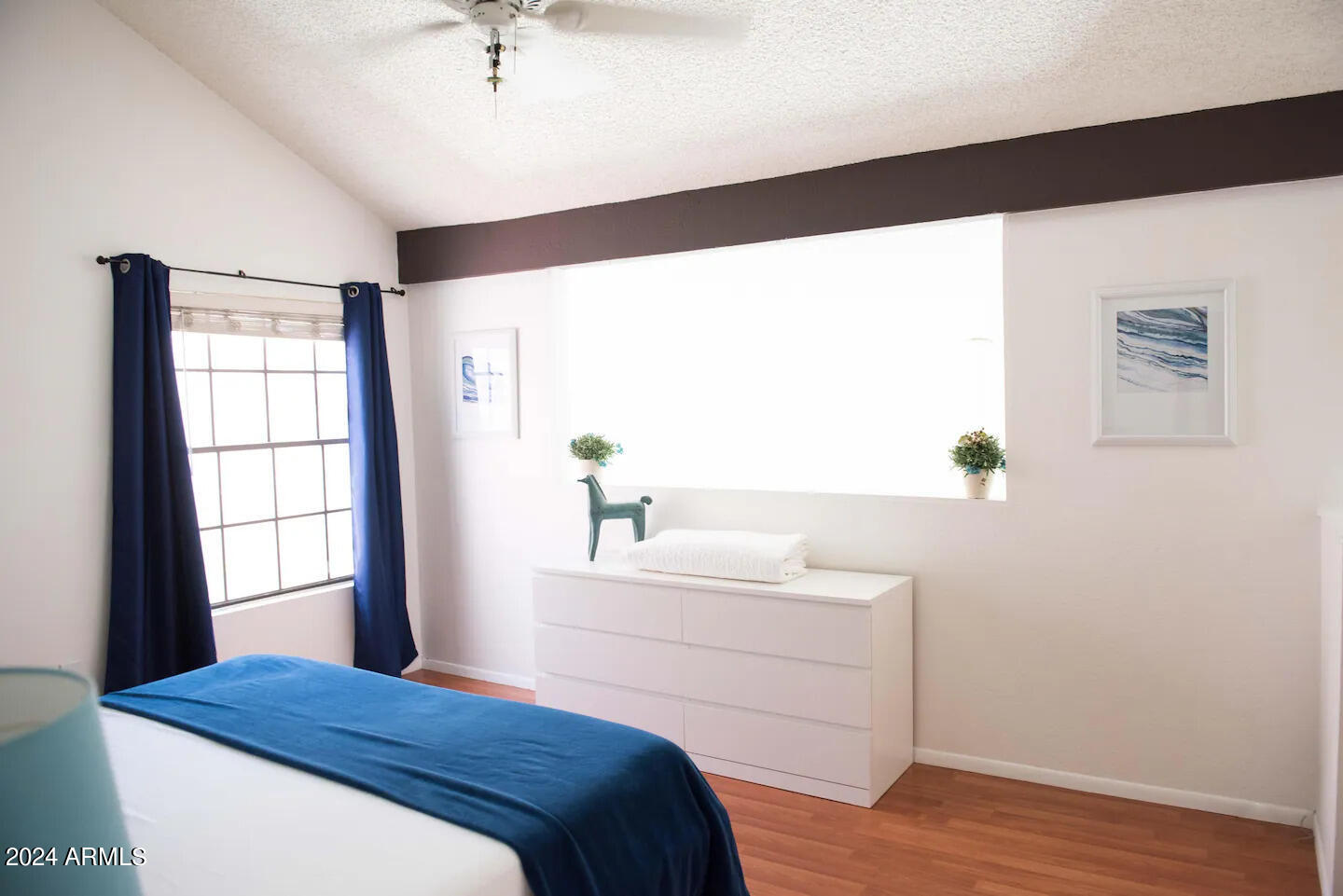 602 North May, Unit 7 Mesa, AZ 85201 - Photo 8 of 18 a bedroom with a bed and a window