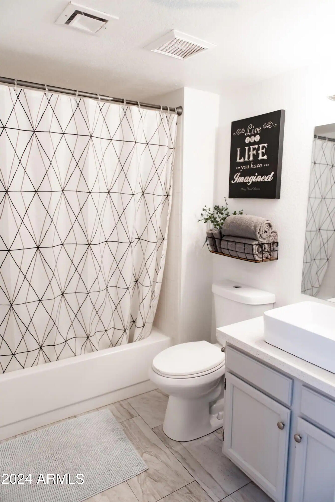 602 North May, Unit 7 Mesa, AZ 85201 - Photo 10 of 18 a bathroom with a toilet and a sink