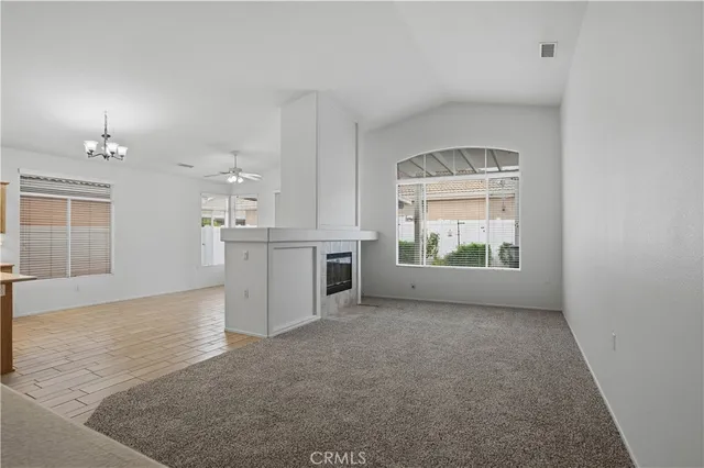 an empty room with windows and entrance