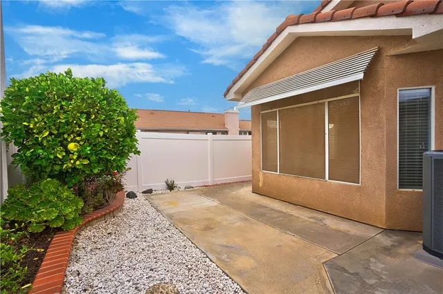 a view of a room with a door and wooden floor