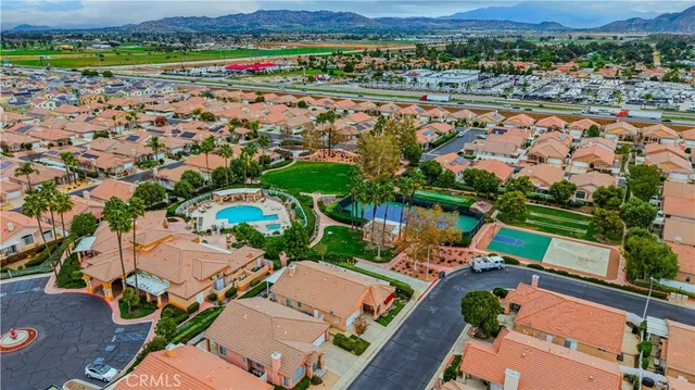 an aerial view of a house with outdoor space and pool