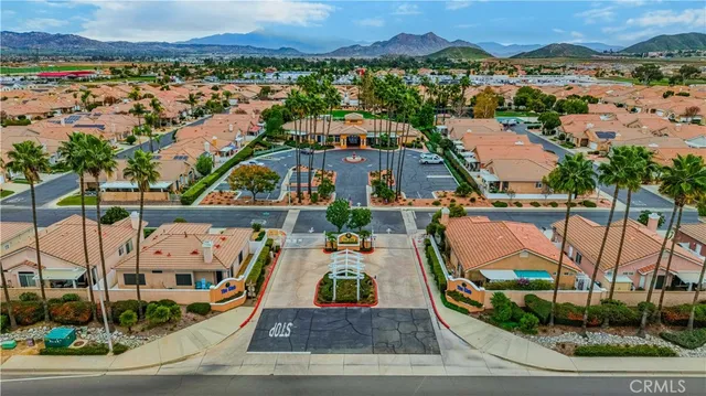 an aerial view of a house with outdoor space pool patio and lake view