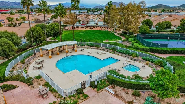 an aerial view of residential houses with outdoor space and river