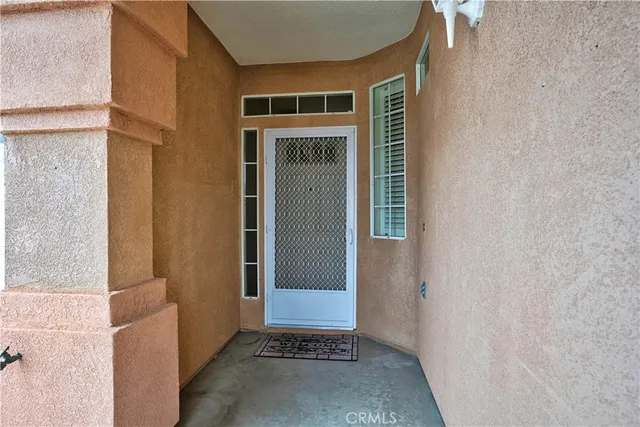 a view of a door and wooden floor