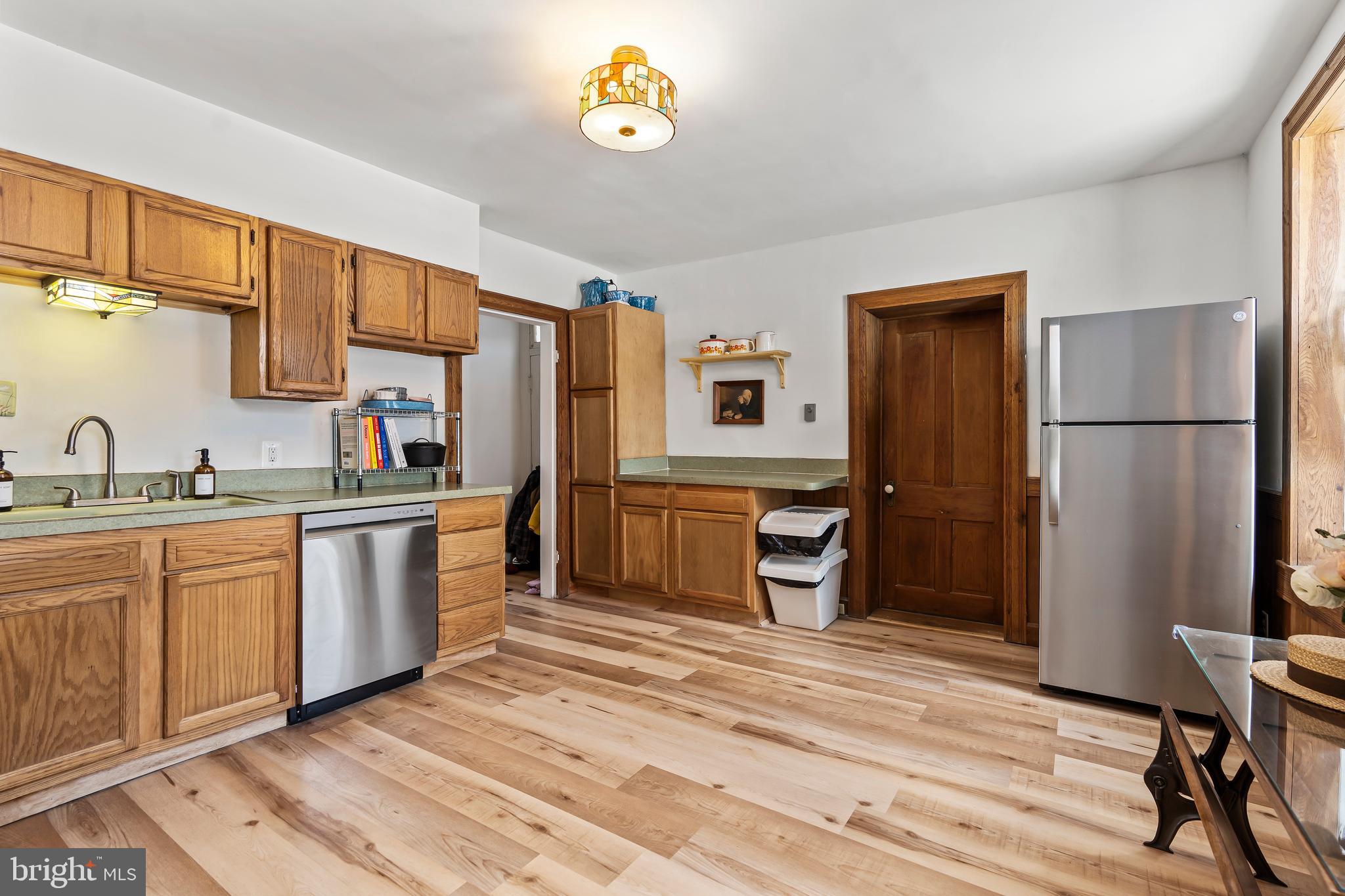 4312 Main Street Rohrersville, MD 21779 - Photo 12 of 58 a kitchen with stainless steel appliances granite countertop a refrigerator sink and cabinets