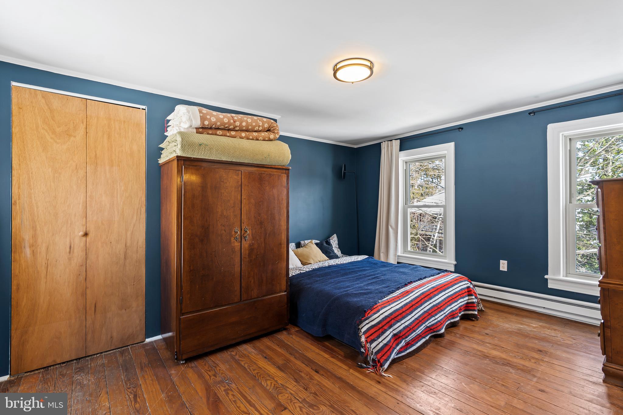 4312 Main Street Rohrersville, MD 21779 - Photo 21 of 58 a bedroom with a bed and wooden floor