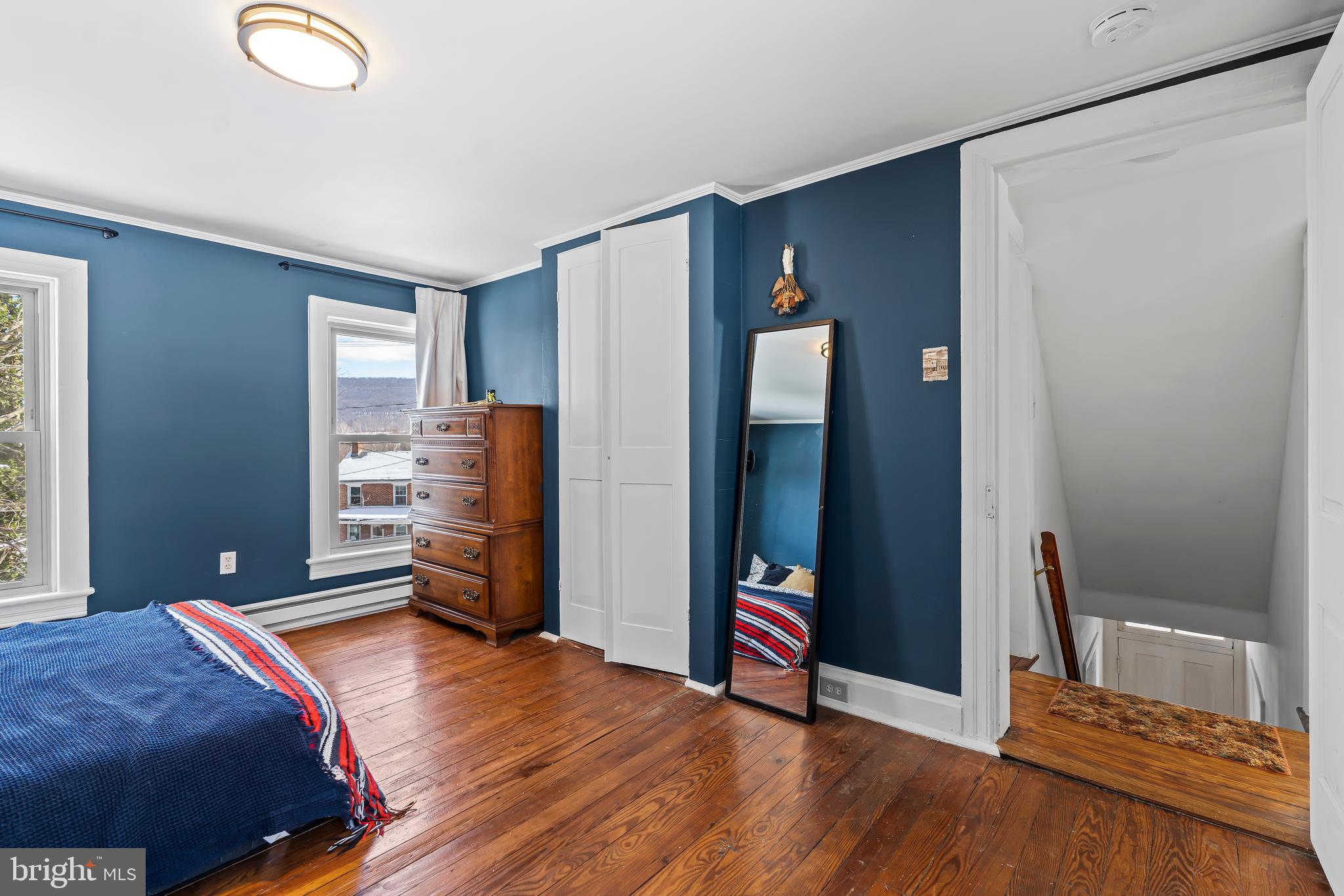 4312 Main Street Rohrersville, MD 21779 - Photo 22 of 58 a bedroom with bed and wooden floor