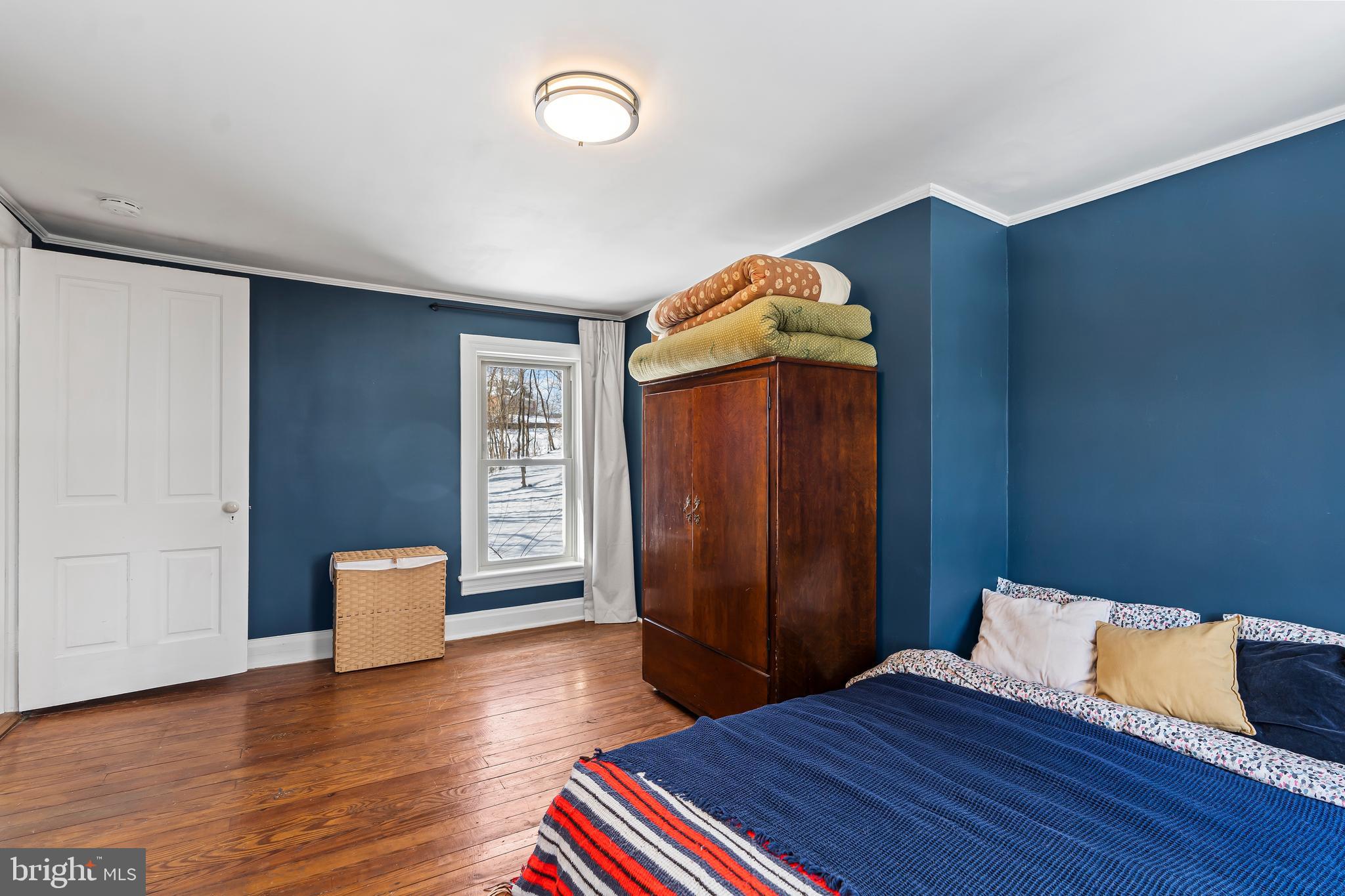 4312 Main Street Rohrersville, MD 21779 - Photo 23 of 58 a bedroom with a bed and wooden floor