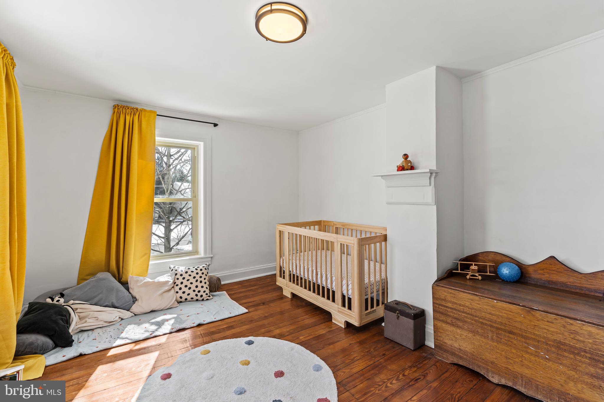 4312 Main Street Rohrersville, MD 21779 - Photo 25 of 58 a bedroom with a bed and wooden floor