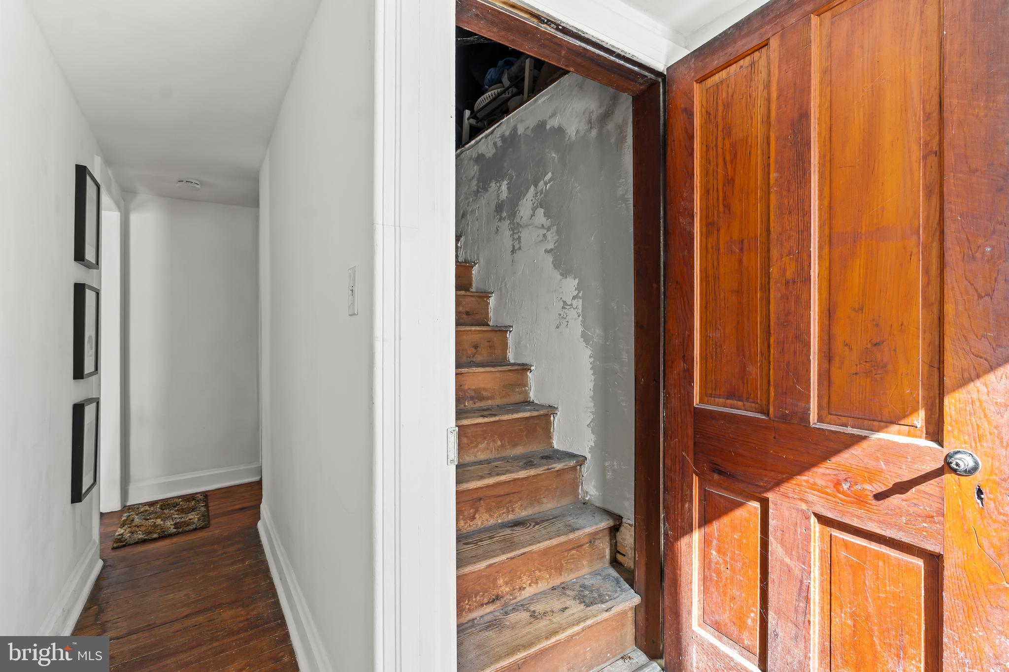 4312 Main Street Rohrersville, MD 21779 - Photo 27 of 58 a view of a hallway with wooden floor and entryway