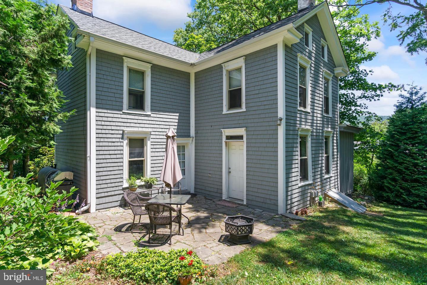 4312 Main Street Rohrersville, MD 21779 - Photo 3 of 58 a view of a chair and table in backyard of the house
