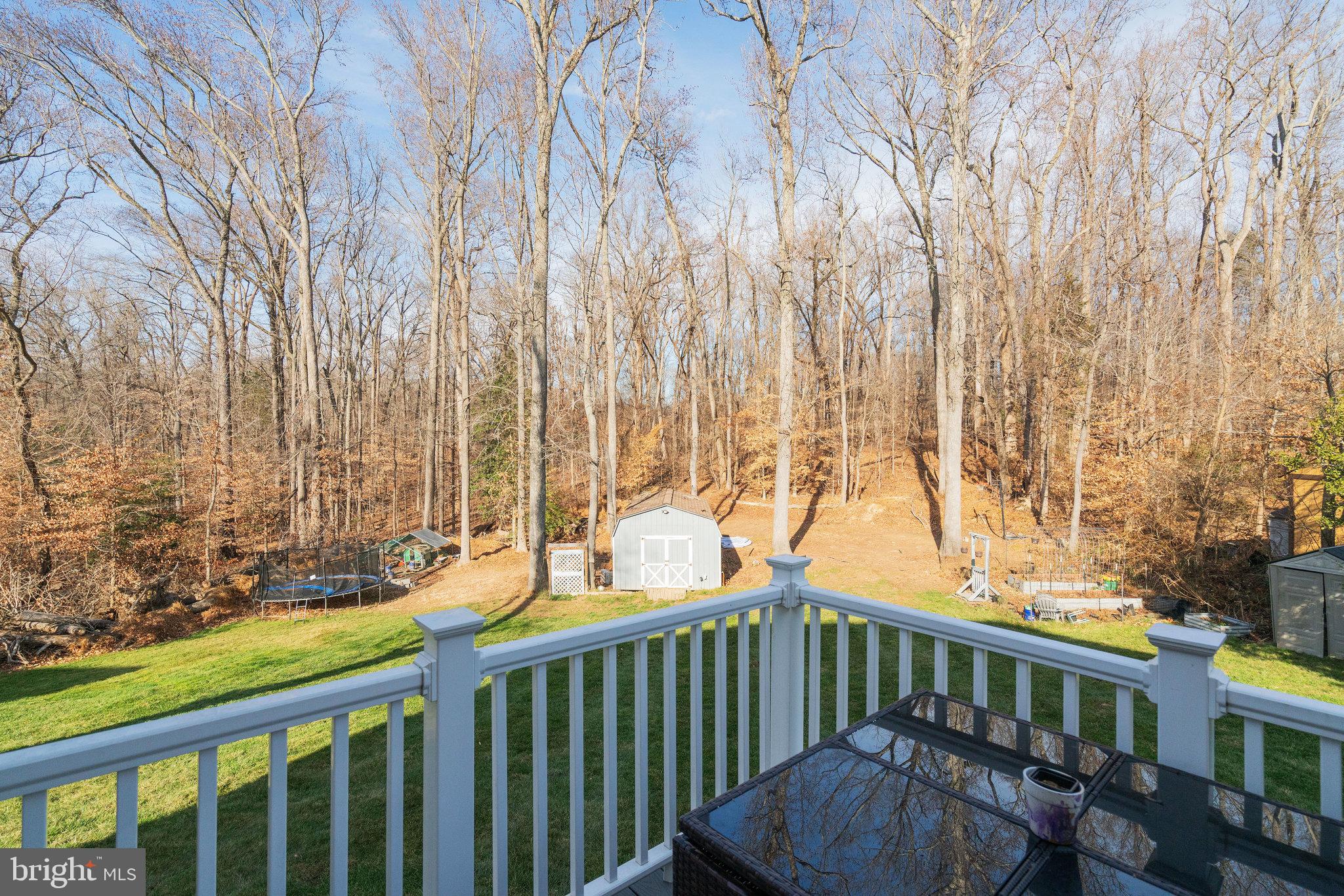 5026 Fallen Timber Way Indian Head, MD 20640 - Photo 50 of 62 a view of a porch with furniture and wooden deck
