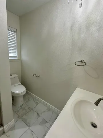 a bathroom with a sink and a toilet