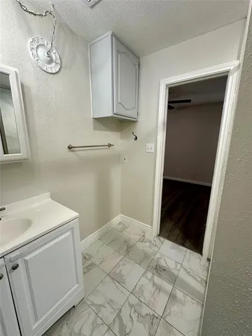 a bathroom with a sink a toilet and vanity
