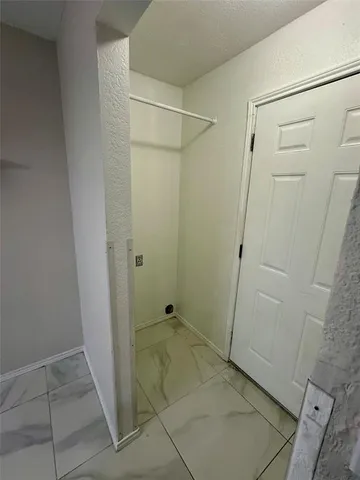 a bathroom with a glass door shower