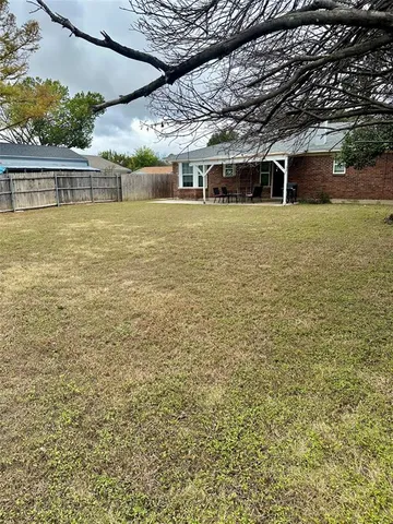 a view of a swimming pool with an outdoor seating