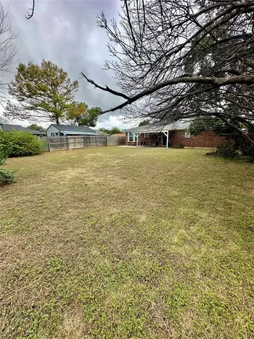 a view of a yard with an outdoor space