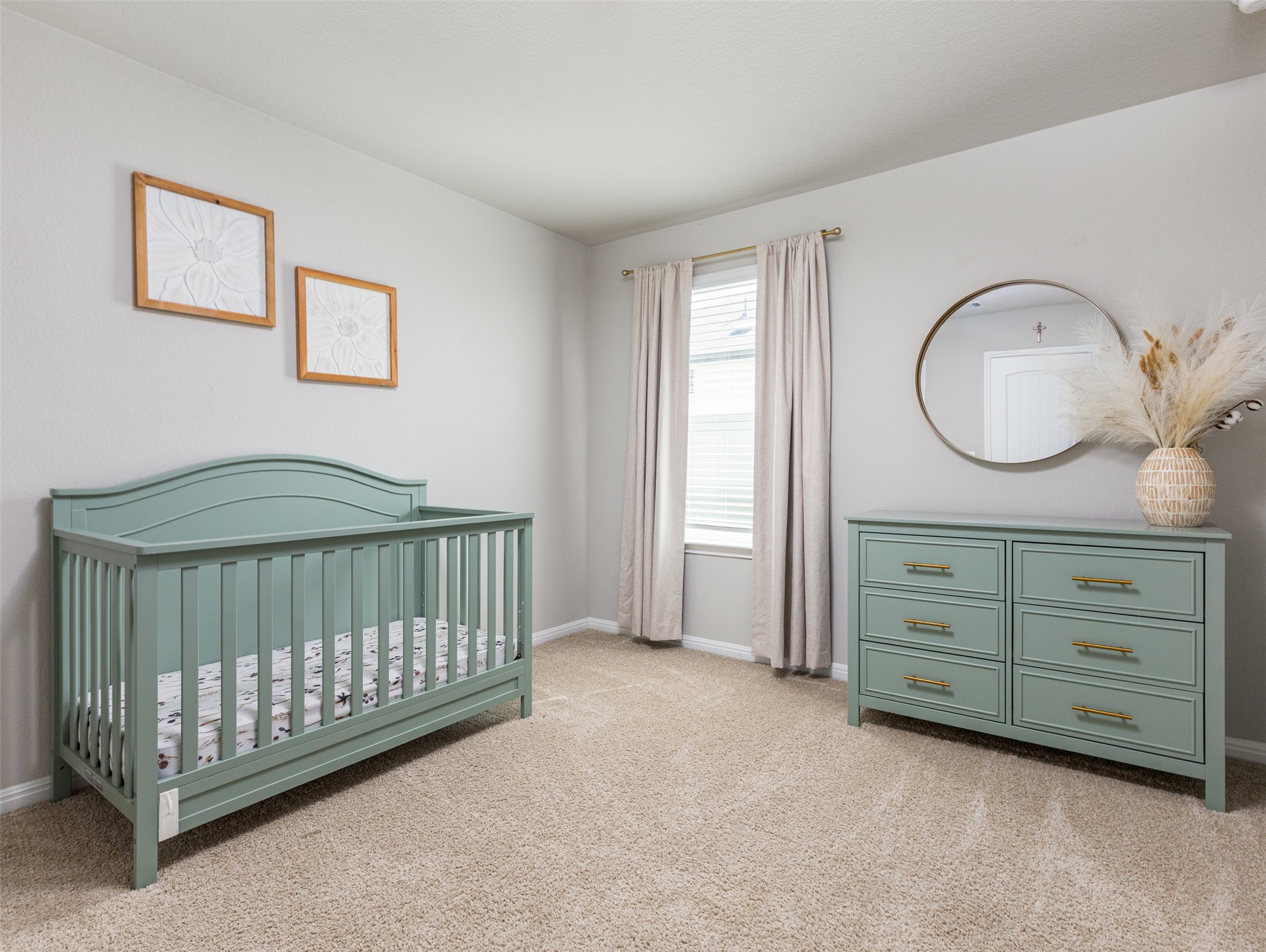 439 Hunter Loop Bertram, TX 78605 - Photo 19 of 23 A comforting nursery with soft neutral walls and plush carpet, ready for a growing family.
