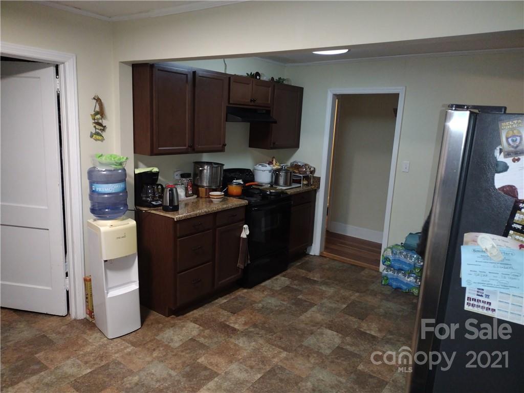 902 Druid Circle Charlotte, NC 28206 - Photo 12 of 24 a kitchen with a refrigerator and a sink