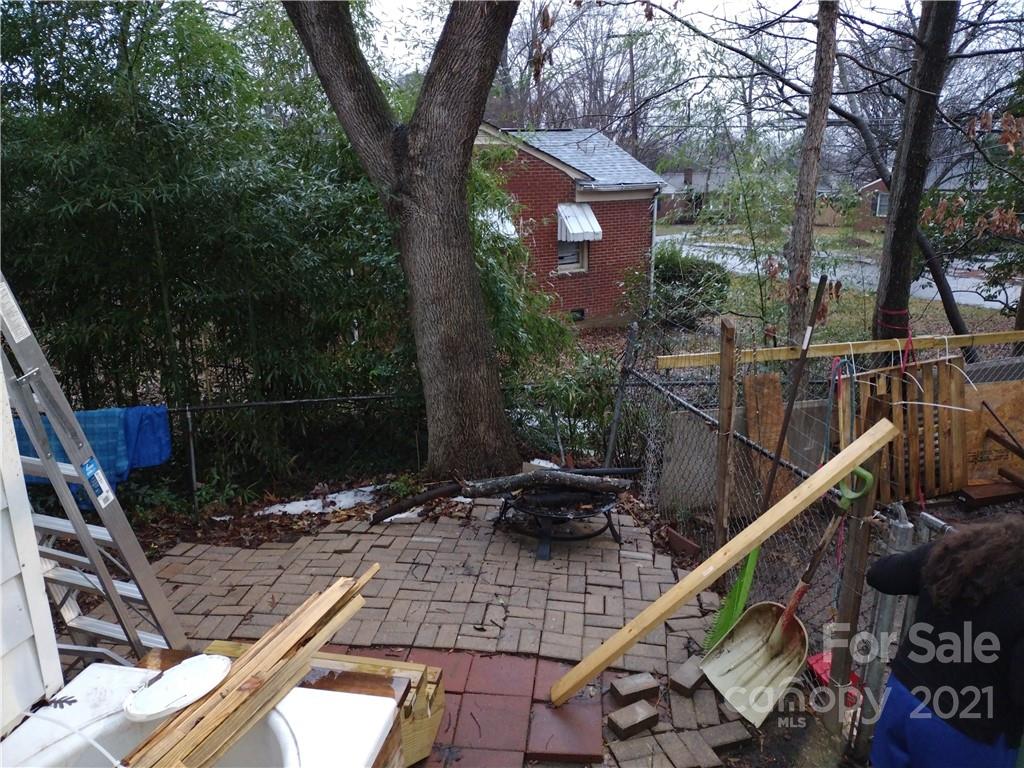 902 Druid Circle Charlotte, NC 28206 - Photo 23 of 24 a backyard of a house with lots of green space and seating