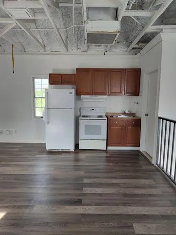 a view of a kitchen with a sink cabinets and a window
