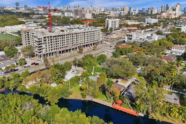 an aerial view of a house with a yard