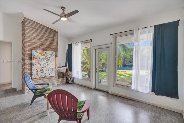 a view of a livingroom with furniture window and wooden floor