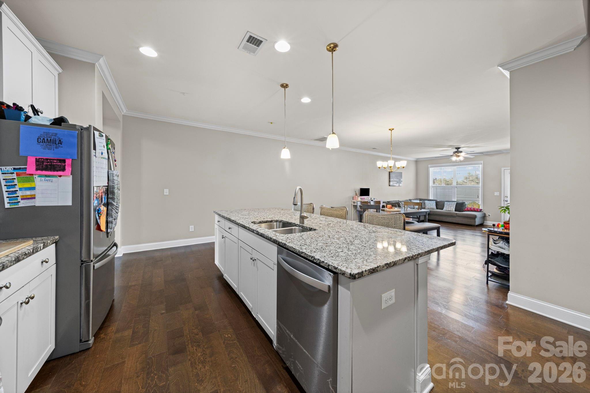 1425 Bramblewood Drive Fort Mill, SC 29708 - Photo 14 of 44 a kitchen with stainless steel appliances granite countertop a sink a refrigerator and a stove