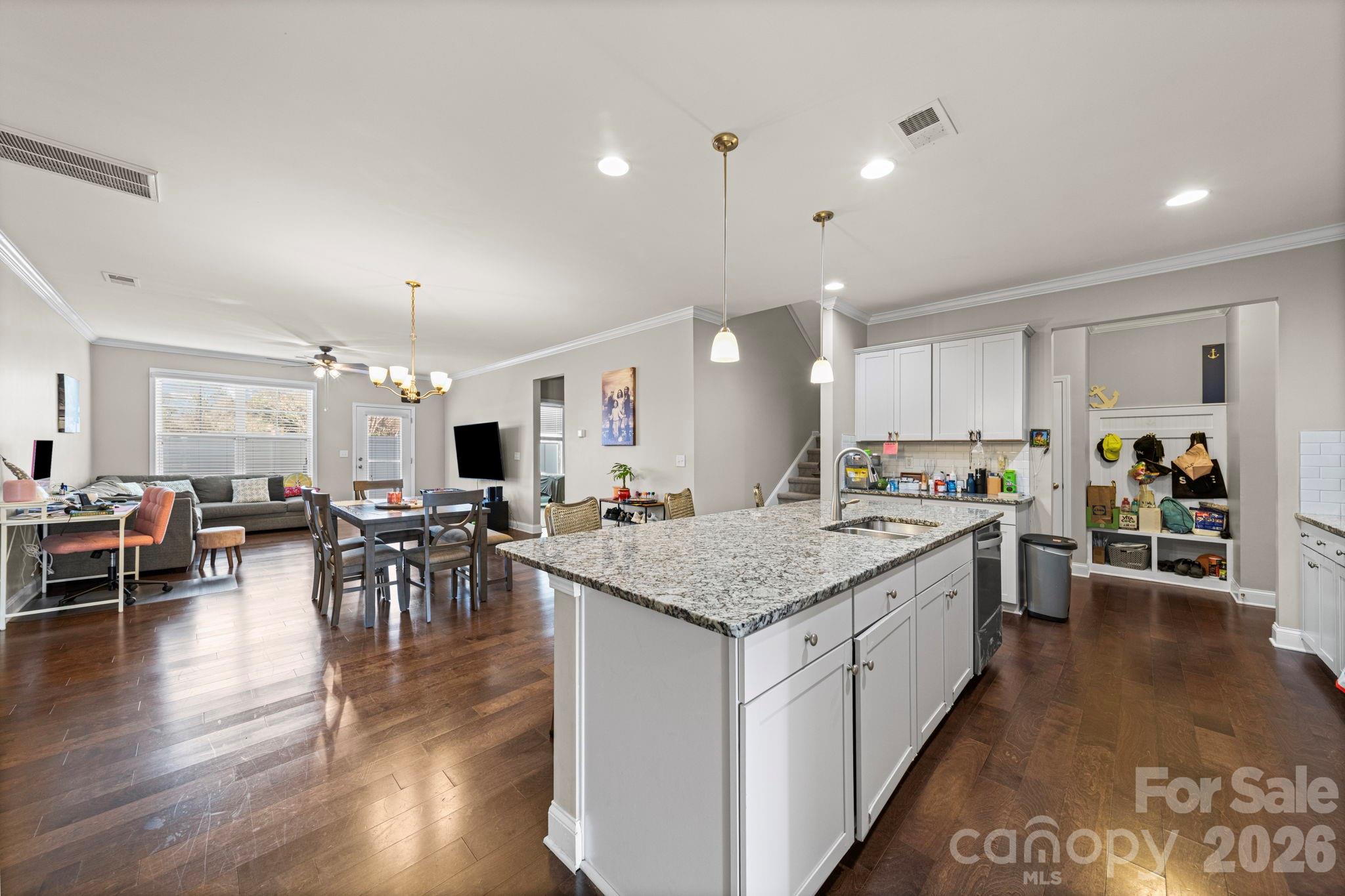 1425 Bramblewood Drive Fort Mill, SC 29708 - Photo 15 of 44 a kitchen with lots of counter top space and painting on the wall