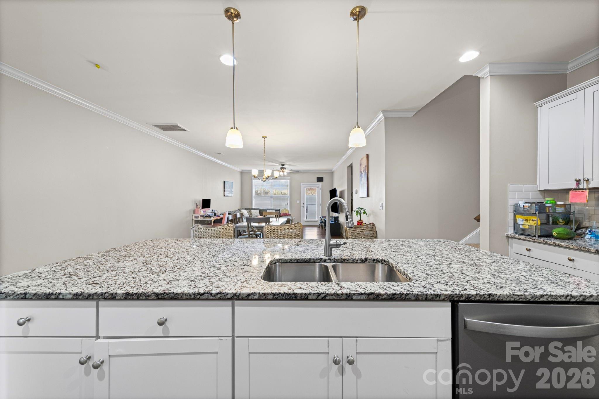 1425 Bramblewood Drive Fort Mill, SC 29708 - Photo 16 of 44 a kitchen with granite countertop a sink a counter top space and cabinets