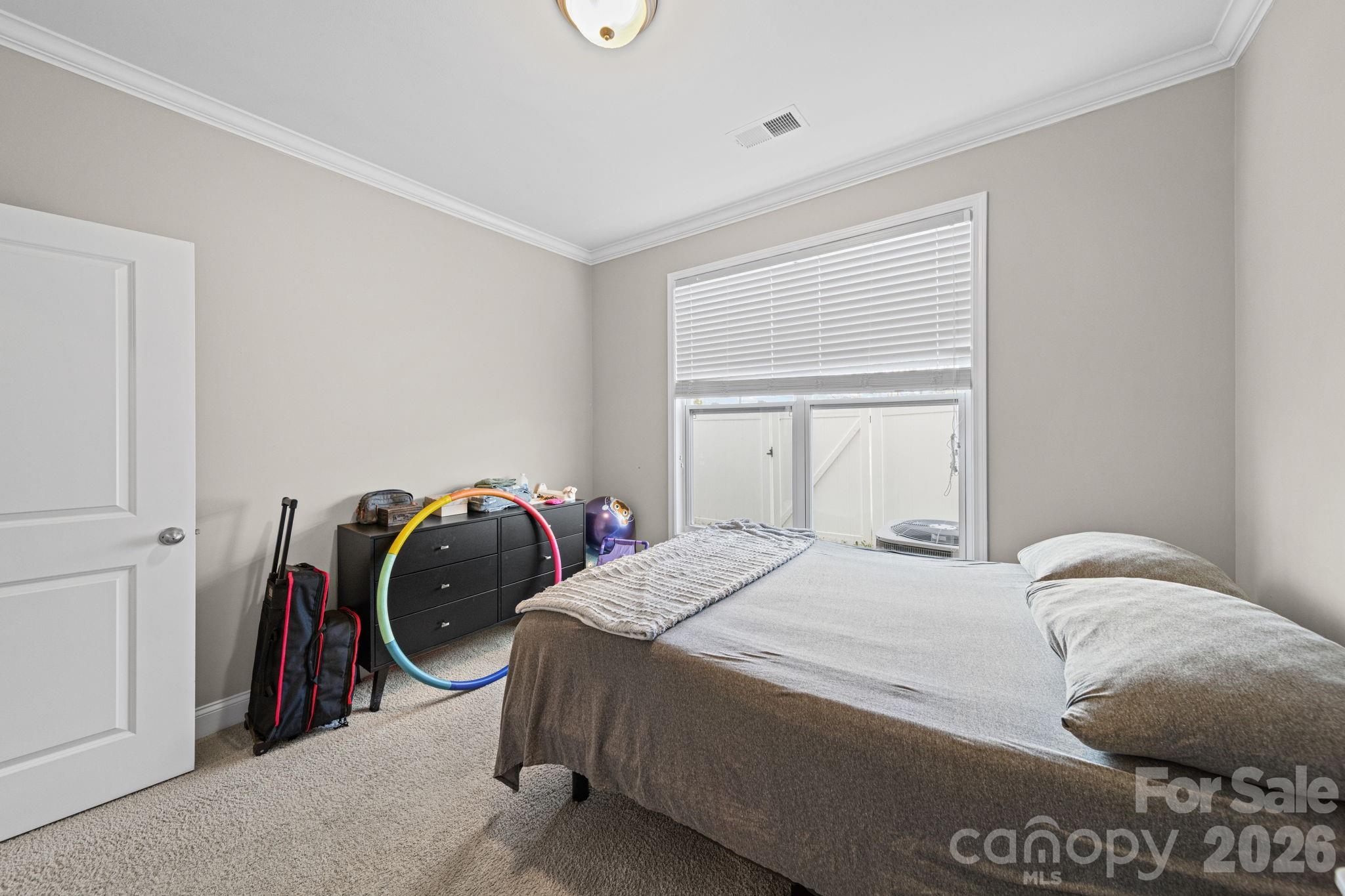 1425 Bramblewood Drive Fort Mill, SC 29708 - Photo 19 of 44 a bedroom with a bed and a closet
