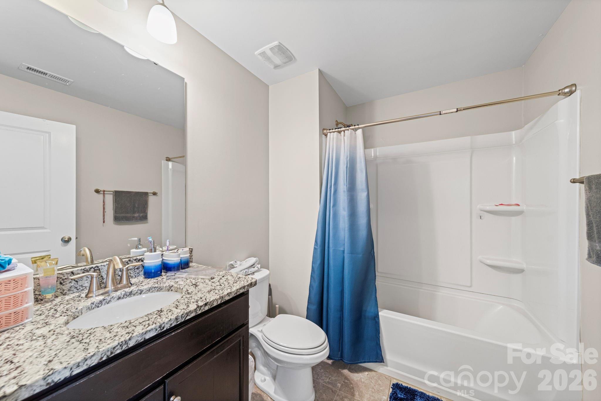 1425 Bramblewood Drive Fort Mill, SC 29708 - Photo 20 of 44 a bathroom with a granite countertop sink toilet and shower