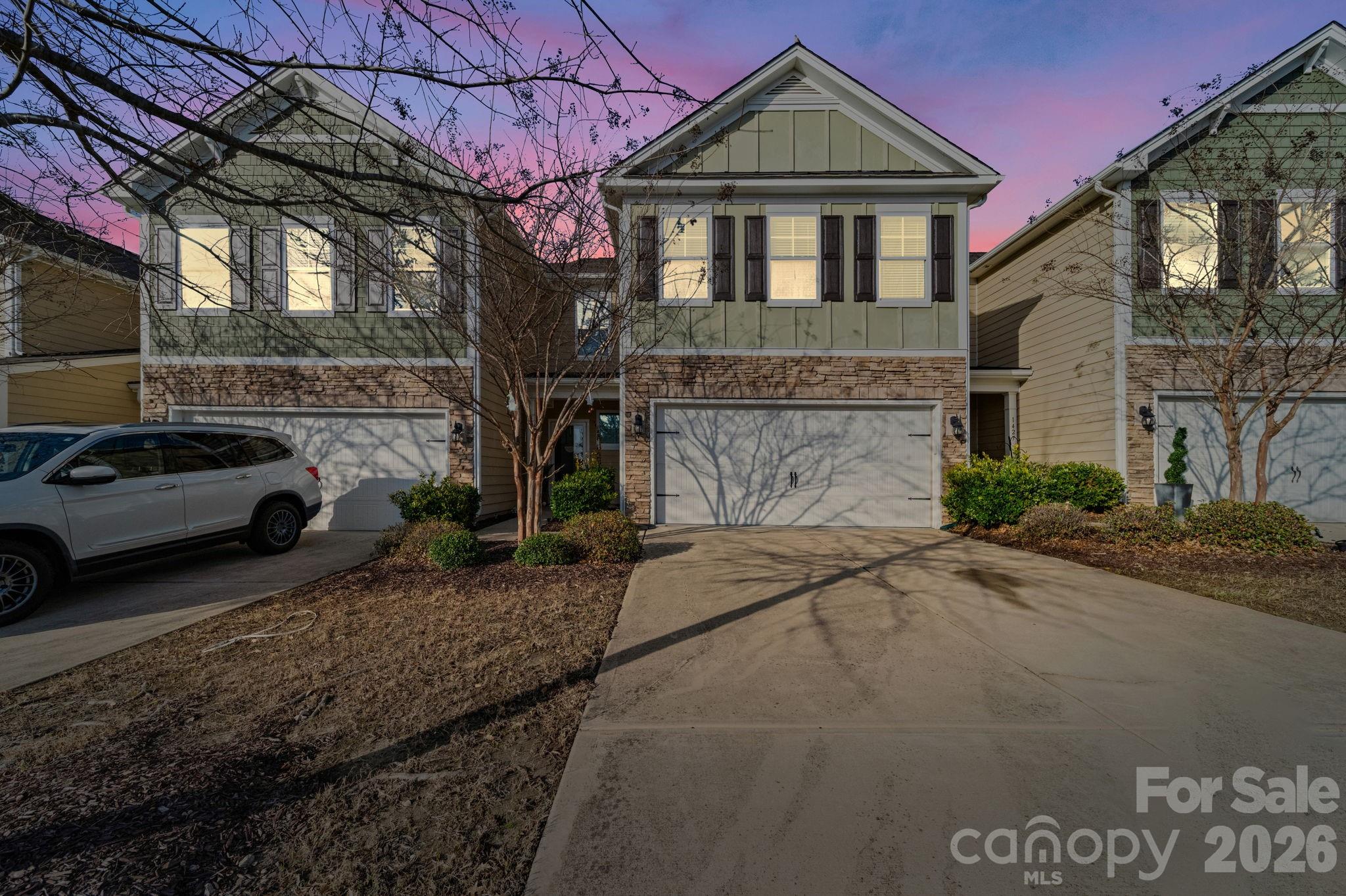 1425 Bramblewood Drive Fort Mill, SC 29708 - Photo 2 of 44 a front view of a house with a garden