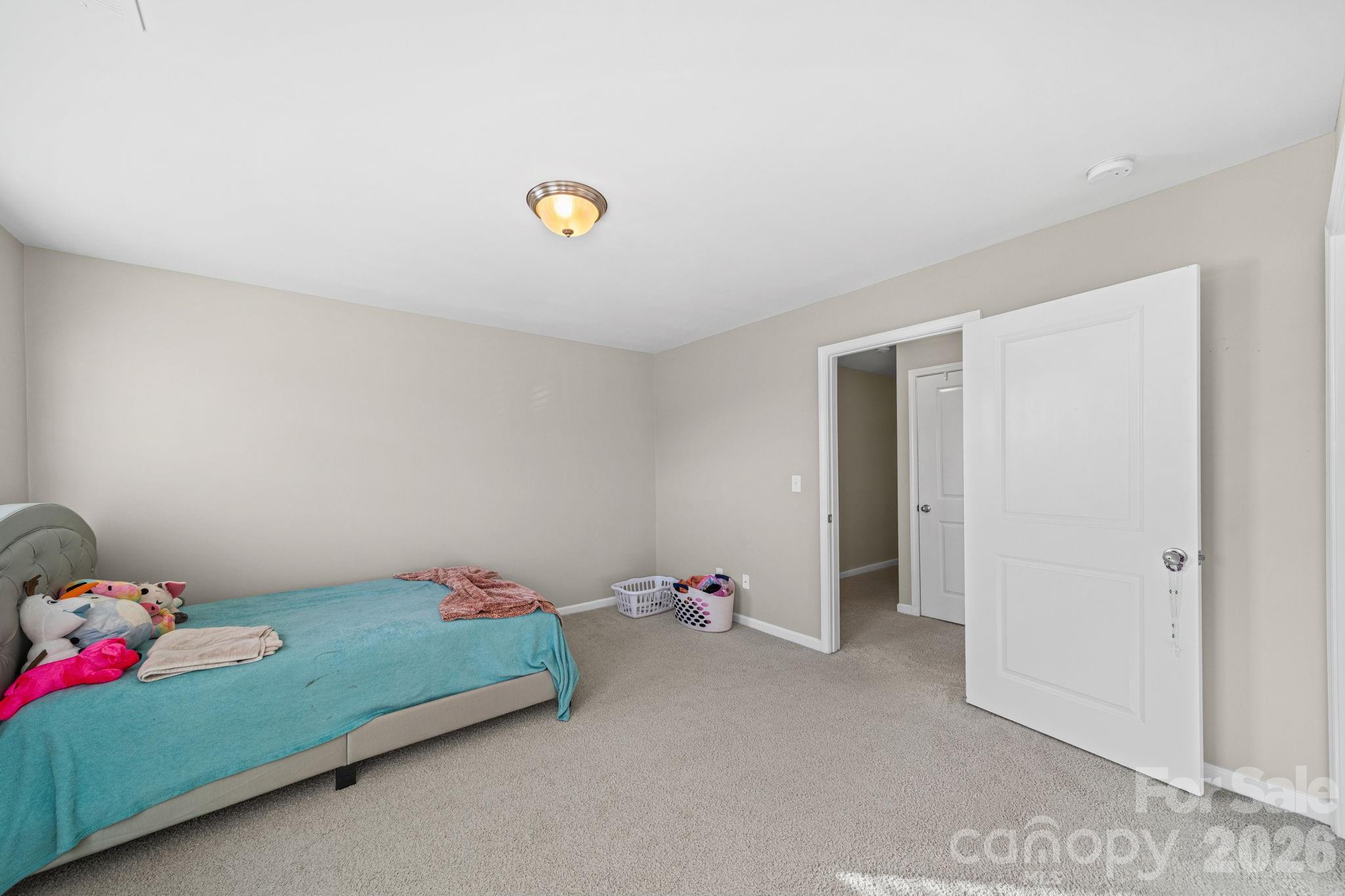 1425 Bramblewood Drive Fort Mill, SC 29708 - Photo 21 of 44 a bedroom with a bed and a dresser