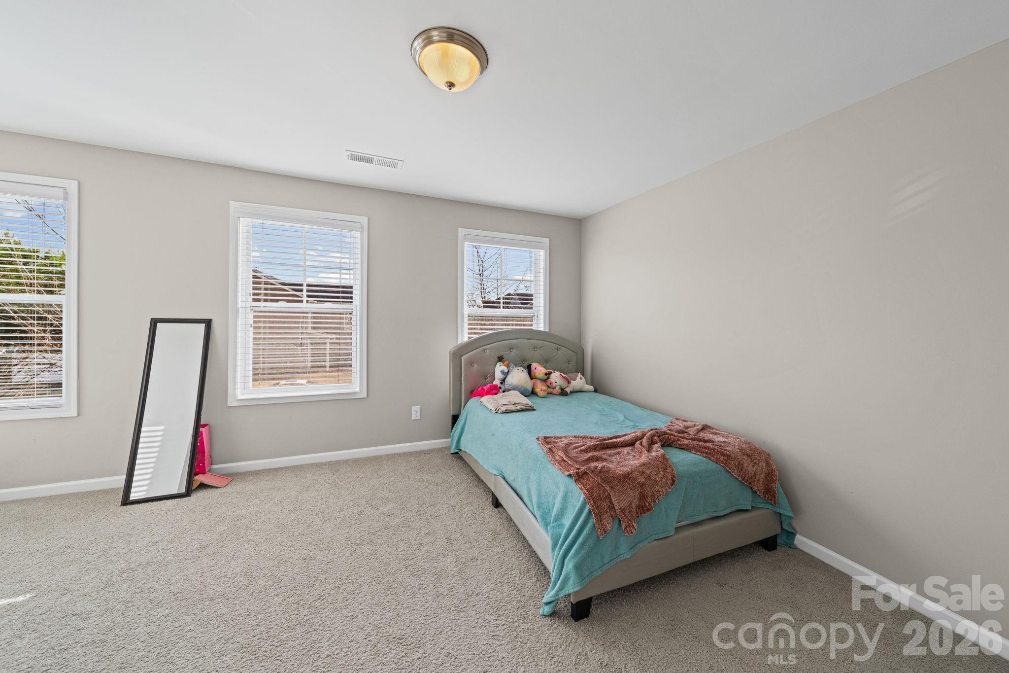 1425 Bramblewood Drive Fort Mill, SC 29708 - Photo 22 of 44 a bedroom with a bed and a window