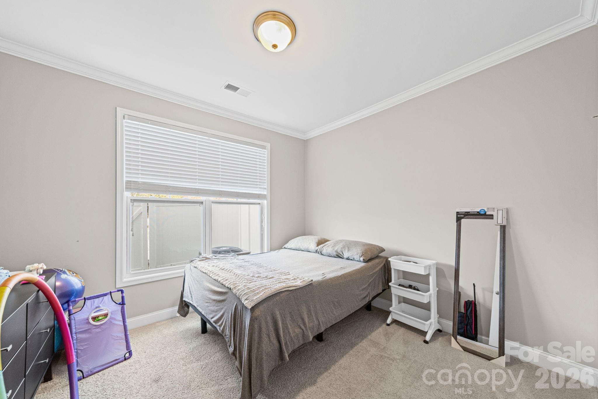 1425 Bramblewood Drive Fort Mill, SC 29708 - Photo 26 of 44 a bedroom with a bed and a window