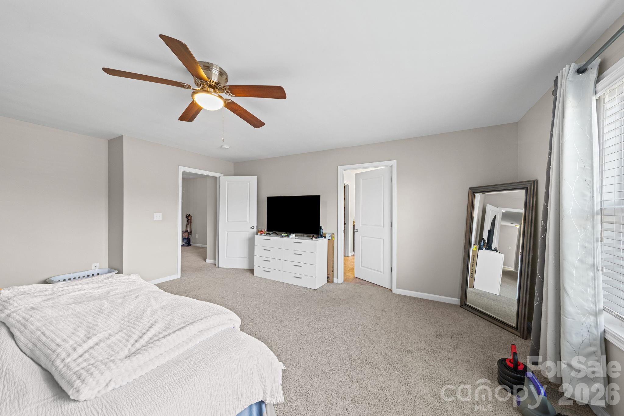 1425 Bramblewood Drive Fort Mill, SC 29708 - Photo 29 of 44 a bedroom with a bed and a flat screen tv