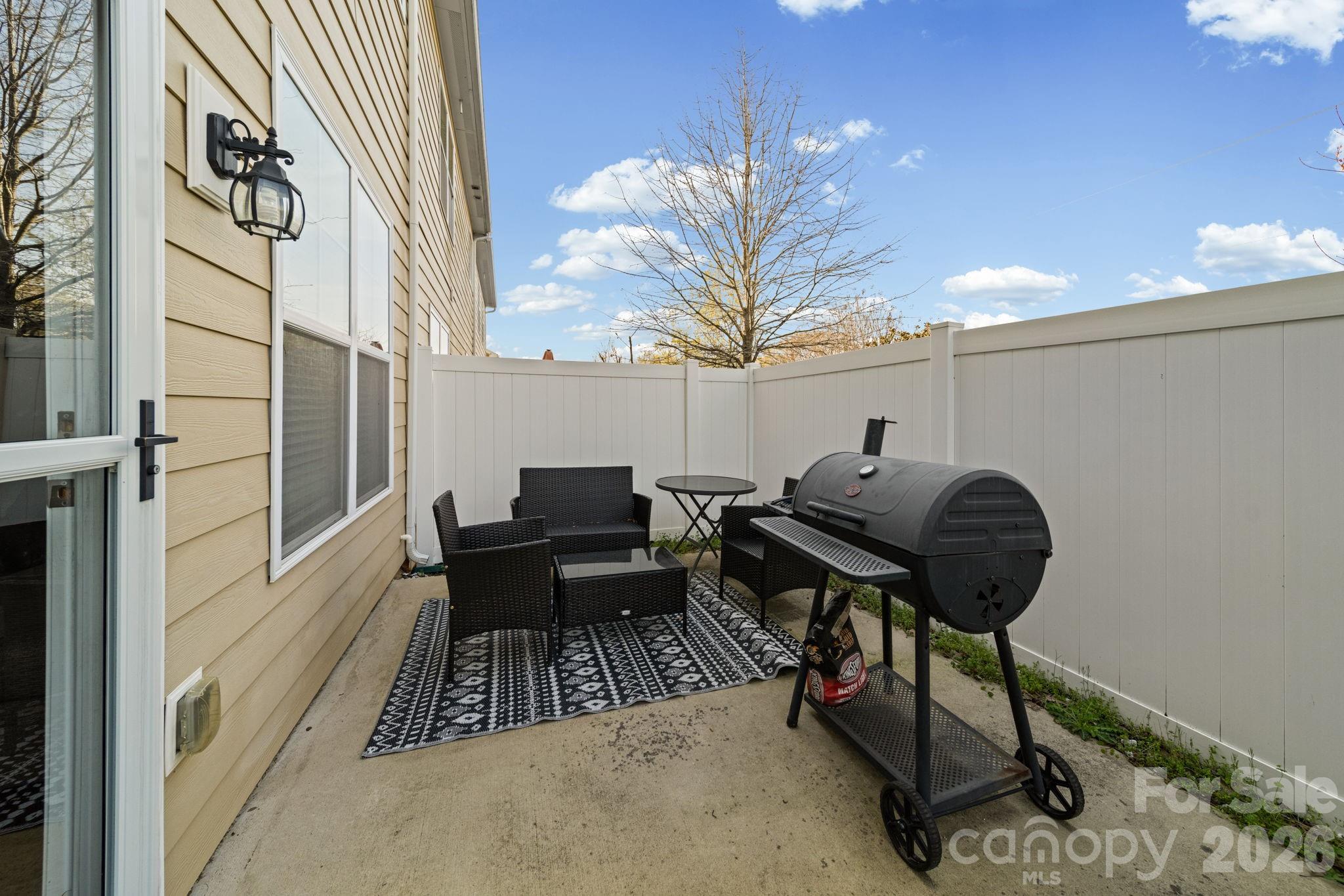 1425 Bramblewood Drive Fort Mill, SC 29708 - Photo 34 of 44 a backyard of a house with table and chairs