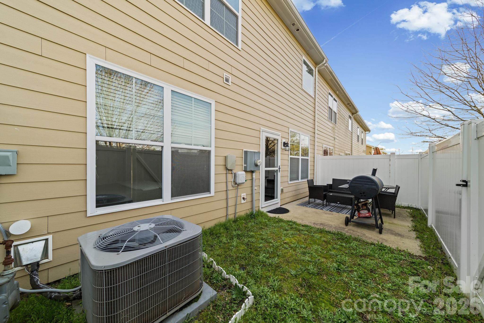 1425 Bramblewood Drive Fort Mill, SC 29708 - Photo 35 of 44 a house view with a sitting space fire pit and outdoor seating
