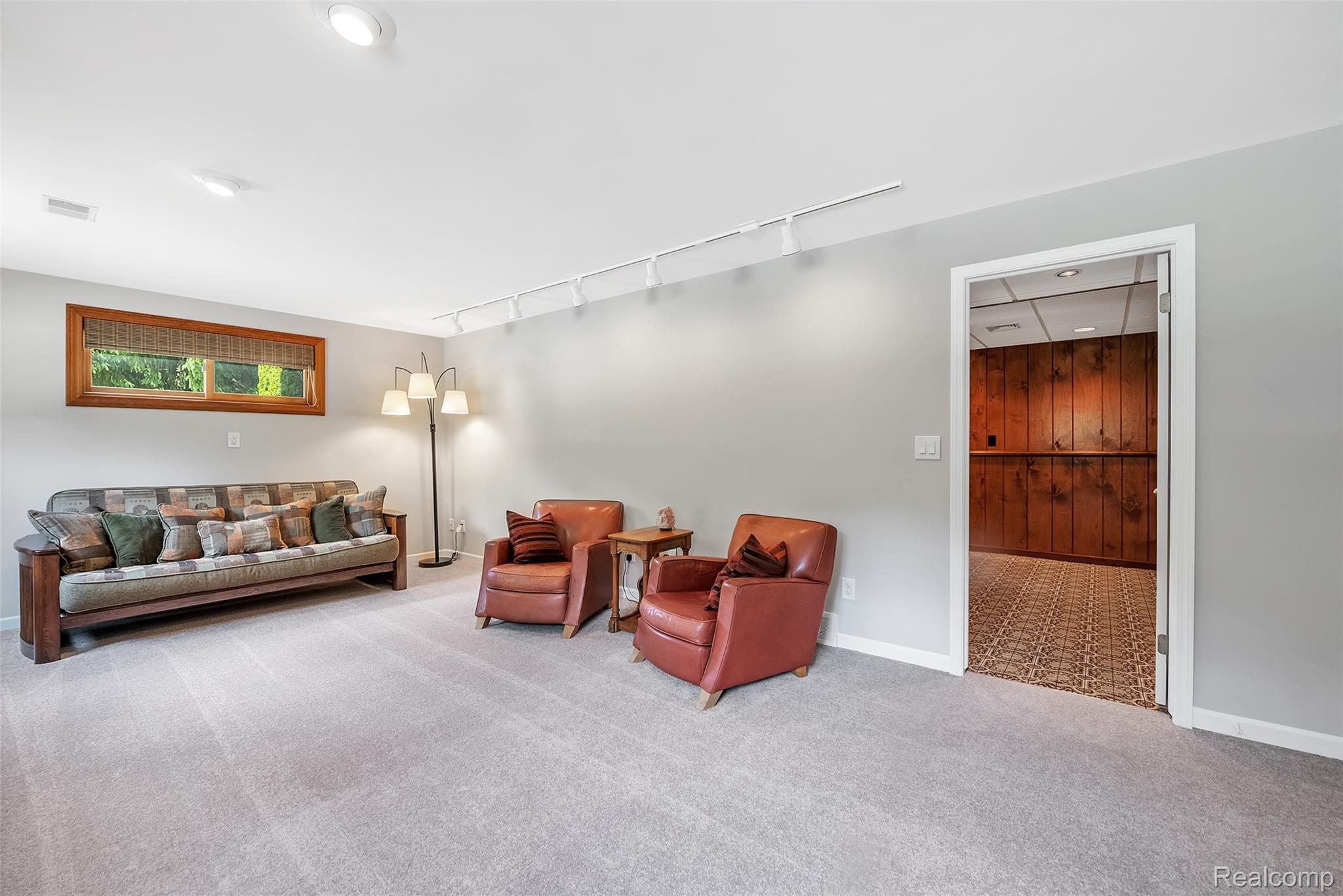 4054 Bennett Lake Road Fenton, MI 48430 - Photo 27 of 57 Lower Level Family Room with Track Lighting
