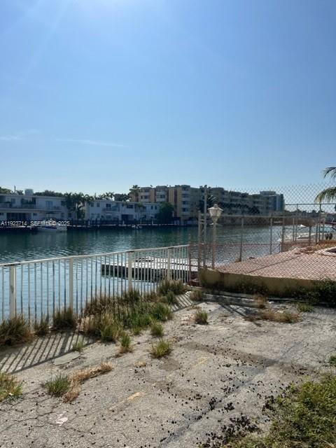 8001 Crespi Boulevard, Unit 2D Miami Beach, FL 33141 - Photo 1 of 20 a backyard of a house with lake view