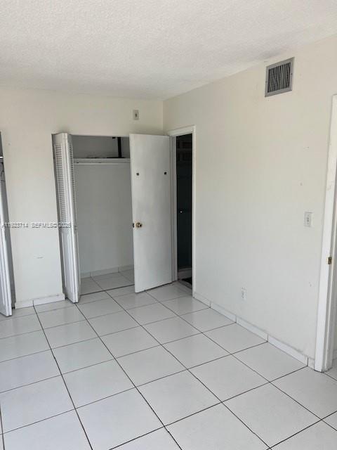 8001 Crespi Boulevard, Unit 2D Miami Beach, FL 33141 - Photo 11 of 20 an empty room with a bathroom