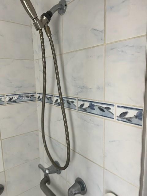 8001 Crespi Boulevard, Unit 2D Miami Beach, FL 33141 - Photo 12 of 20 a bathroom with a shower and a sink