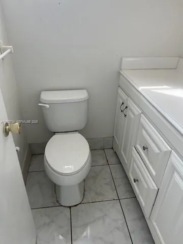 a bathroom with a toilet and a sink