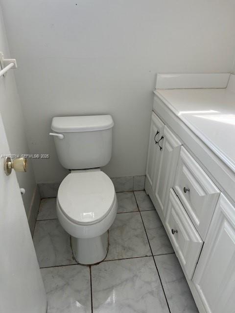 8001 Crespi Boulevard, Unit 2D Miami Beach, FL 33141 - Photo 15 of 20 a bathroom with a toilet and a sink