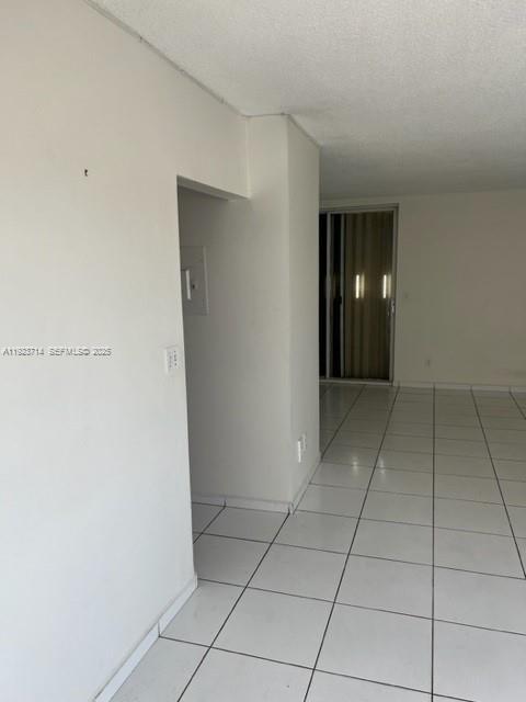 8001 Crespi Boulevard, Unit 2D Miami Beach, FL 33141 - Photo 17 of 20 a view of hallway with a window and a refrigerator